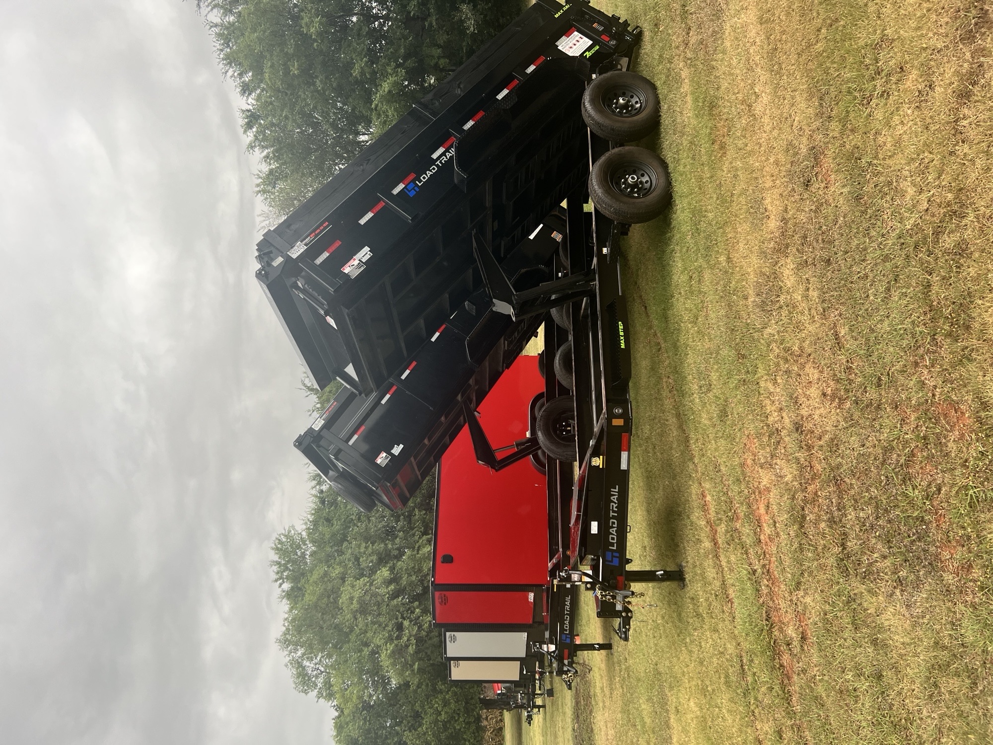 Load Trail dump trailers with beds raised alongside WrightWay fleet in Blanchard Oklahoma
